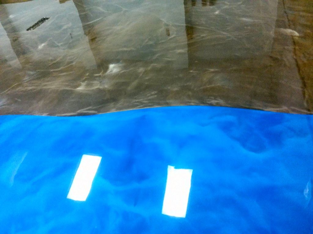 Ocean-blue and mocha metallic epoxy floor